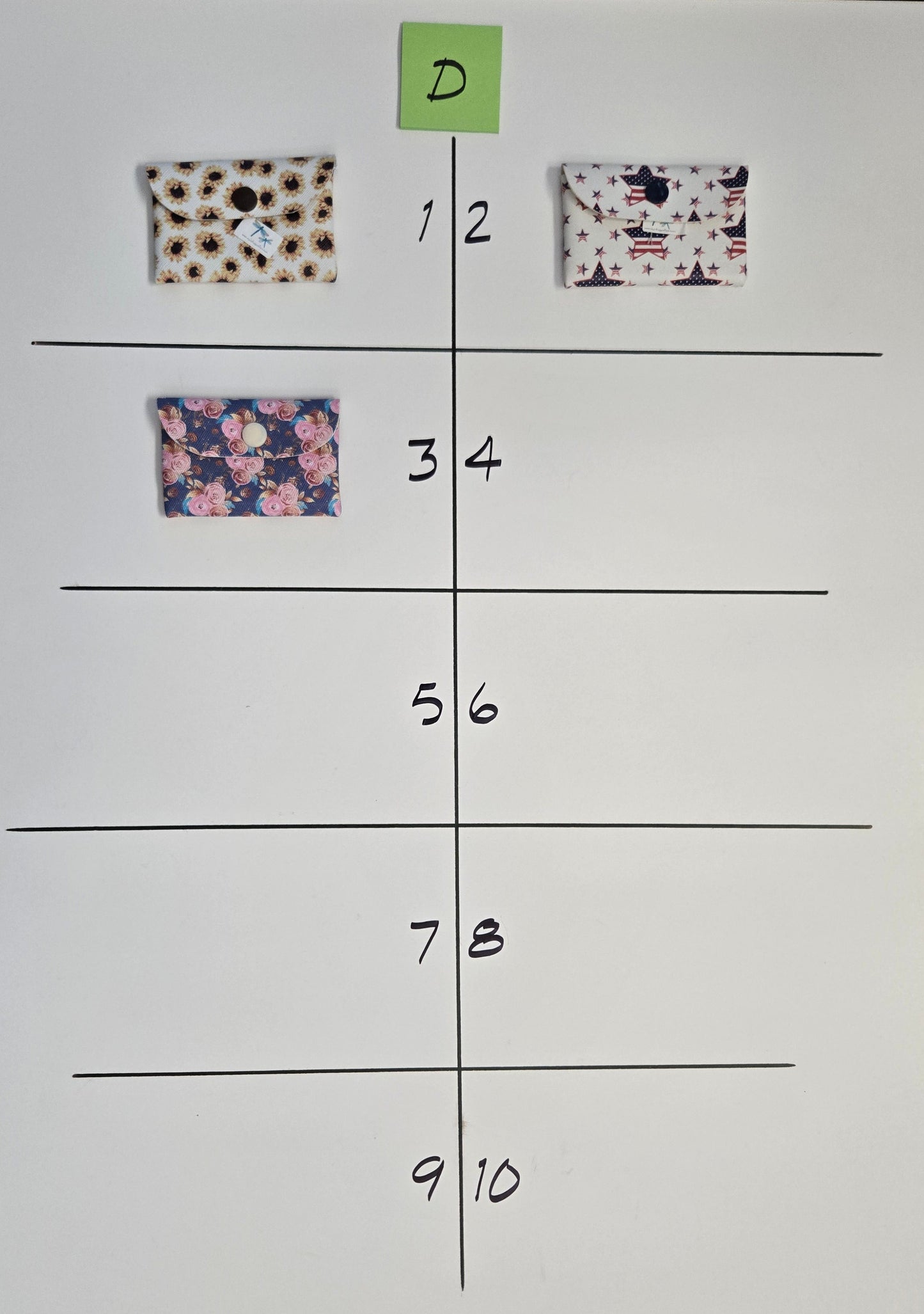 Grid with floral patterned cards on a white sheet of paper