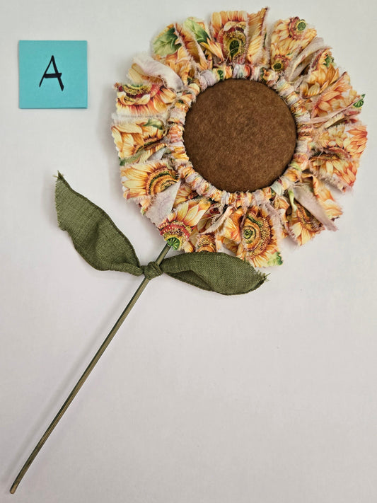 Decorative sunflower plant pick with a plain background