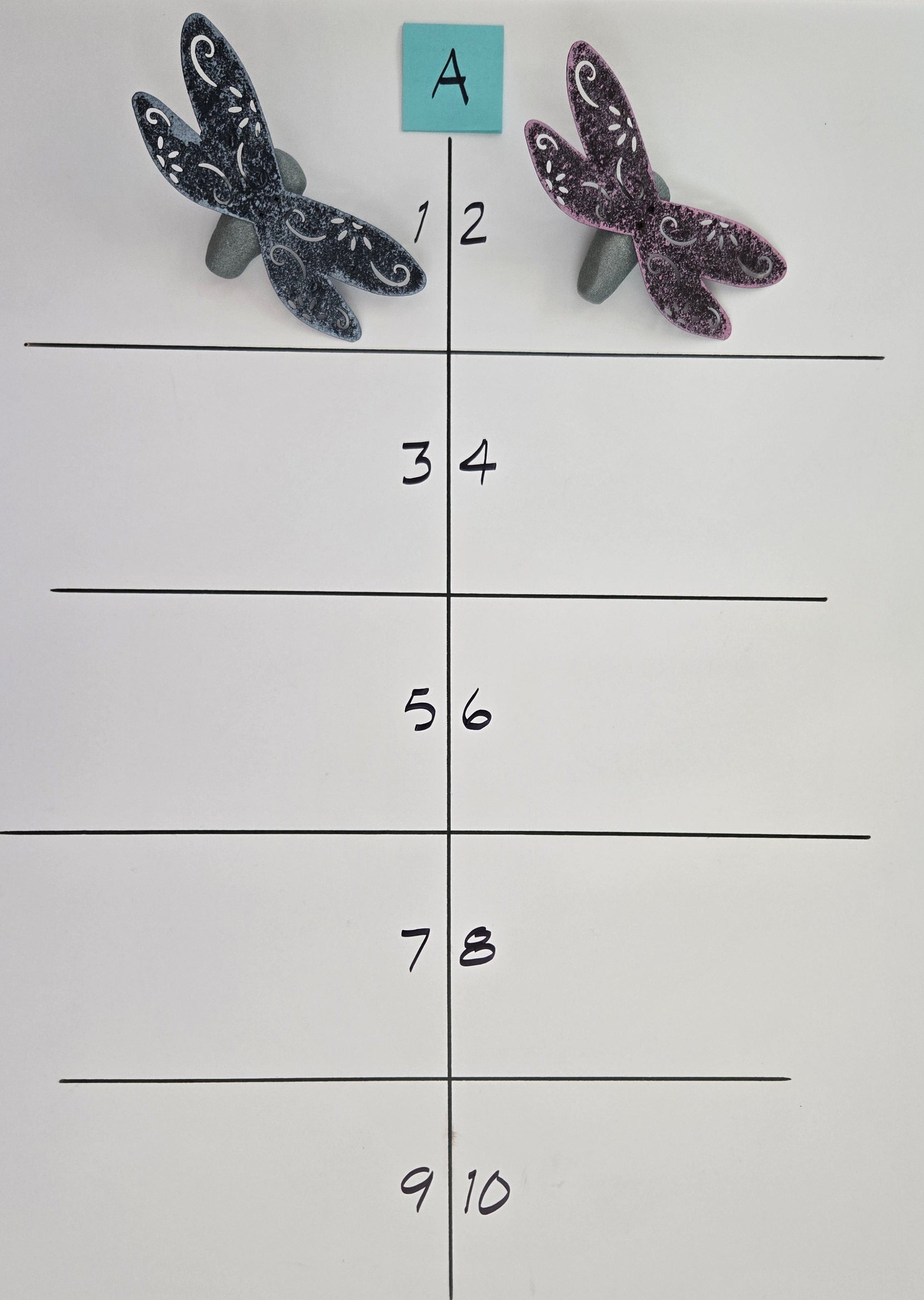 Dragonfly-shaped objects on a grid with labeled rows and columns.