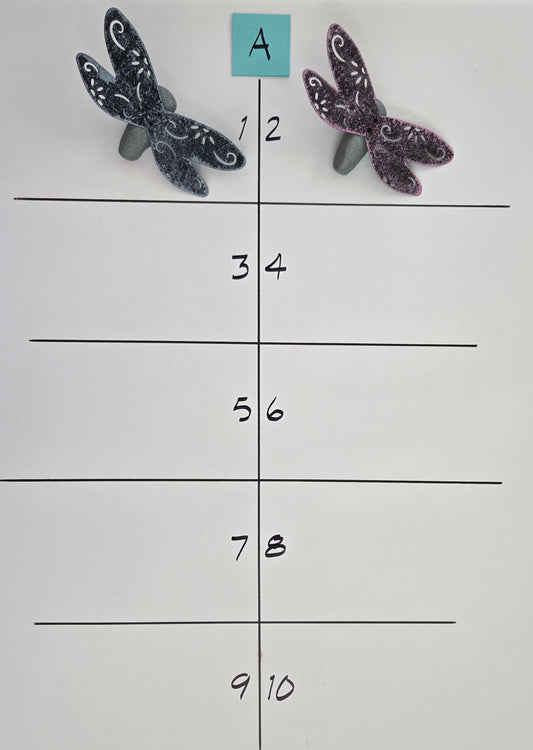 Dragonfly-shaped objects on a grid with labeled rows and columns.
