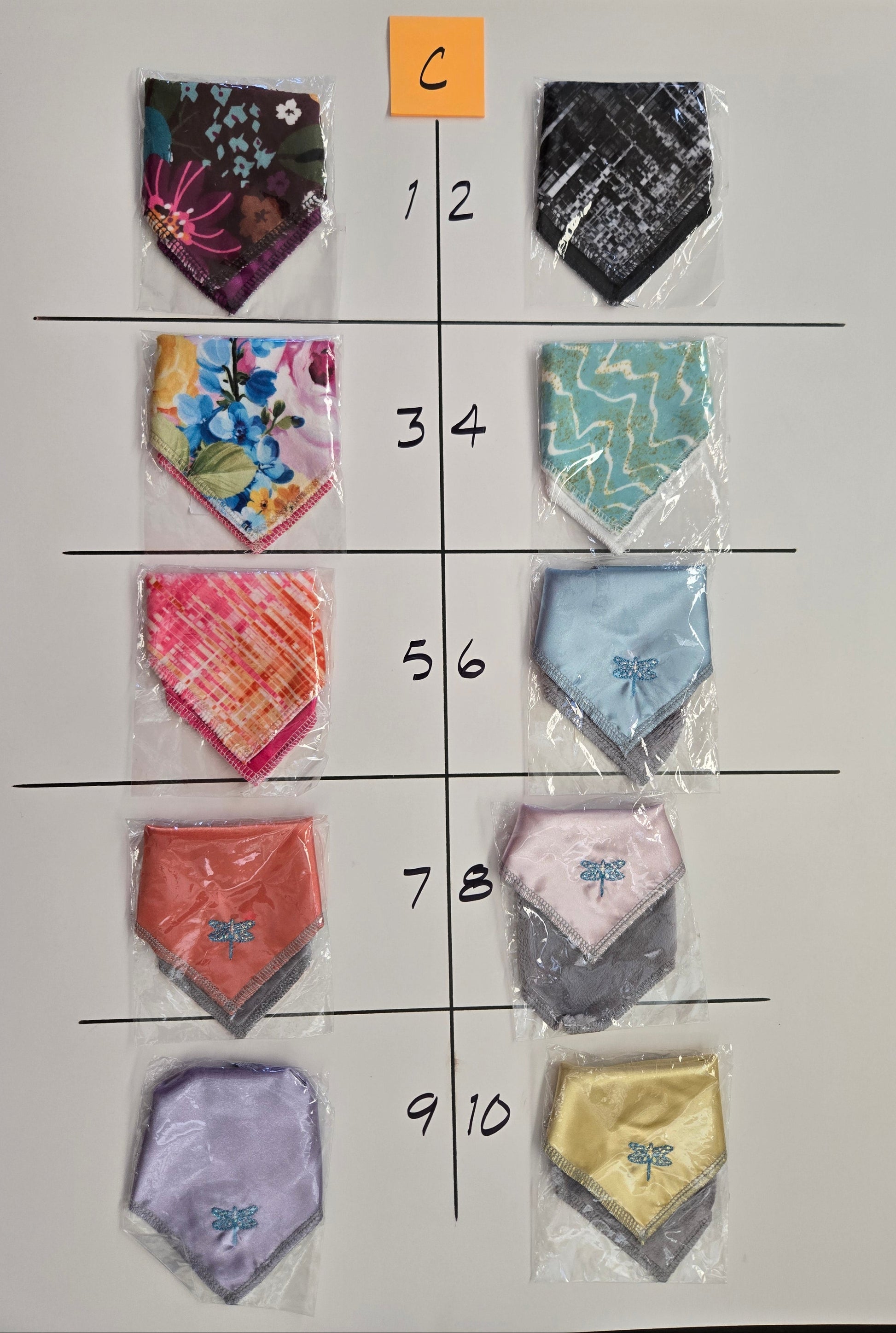 Fabric samples in various colors and patterns arranged in a grid on a white background.