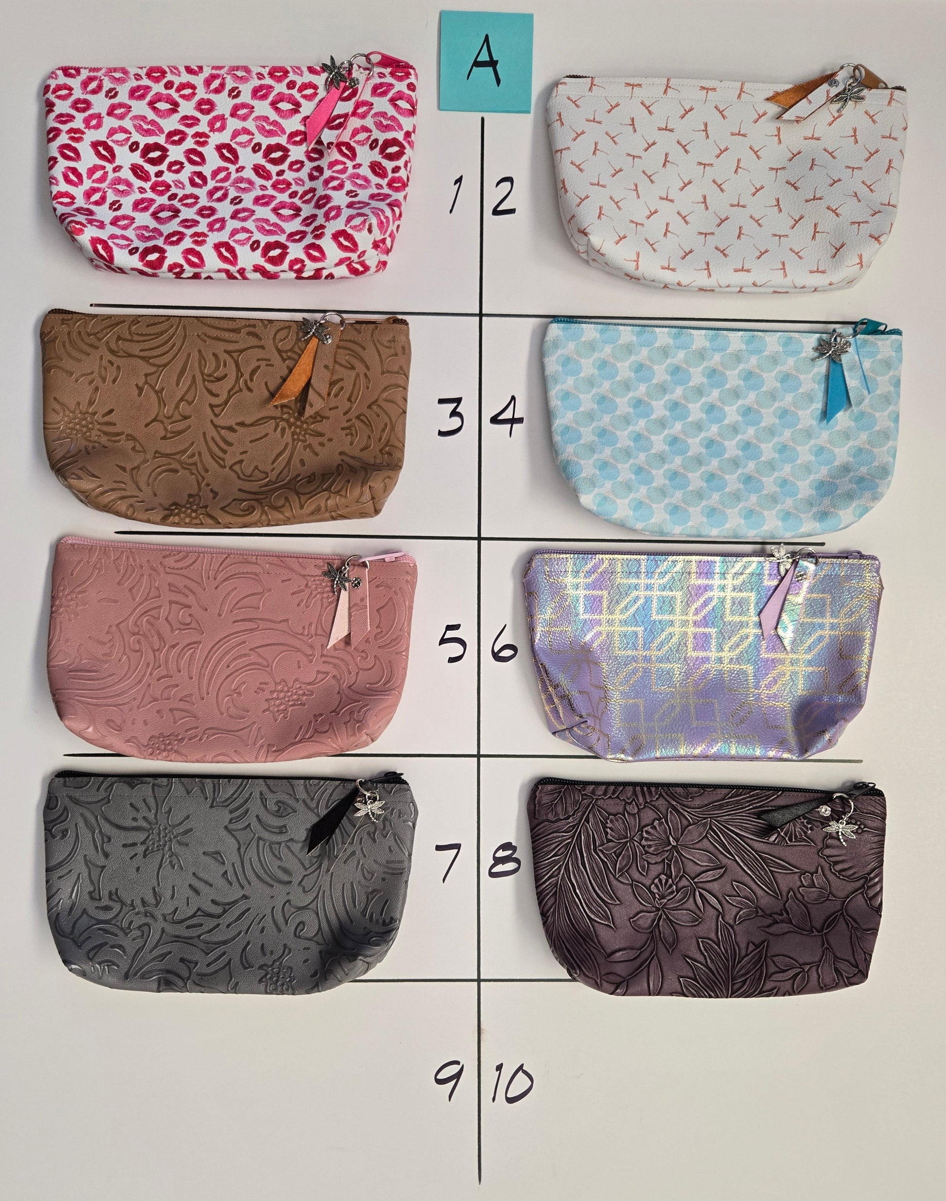 Eight patterned pouches arranged in a grid on a white background.