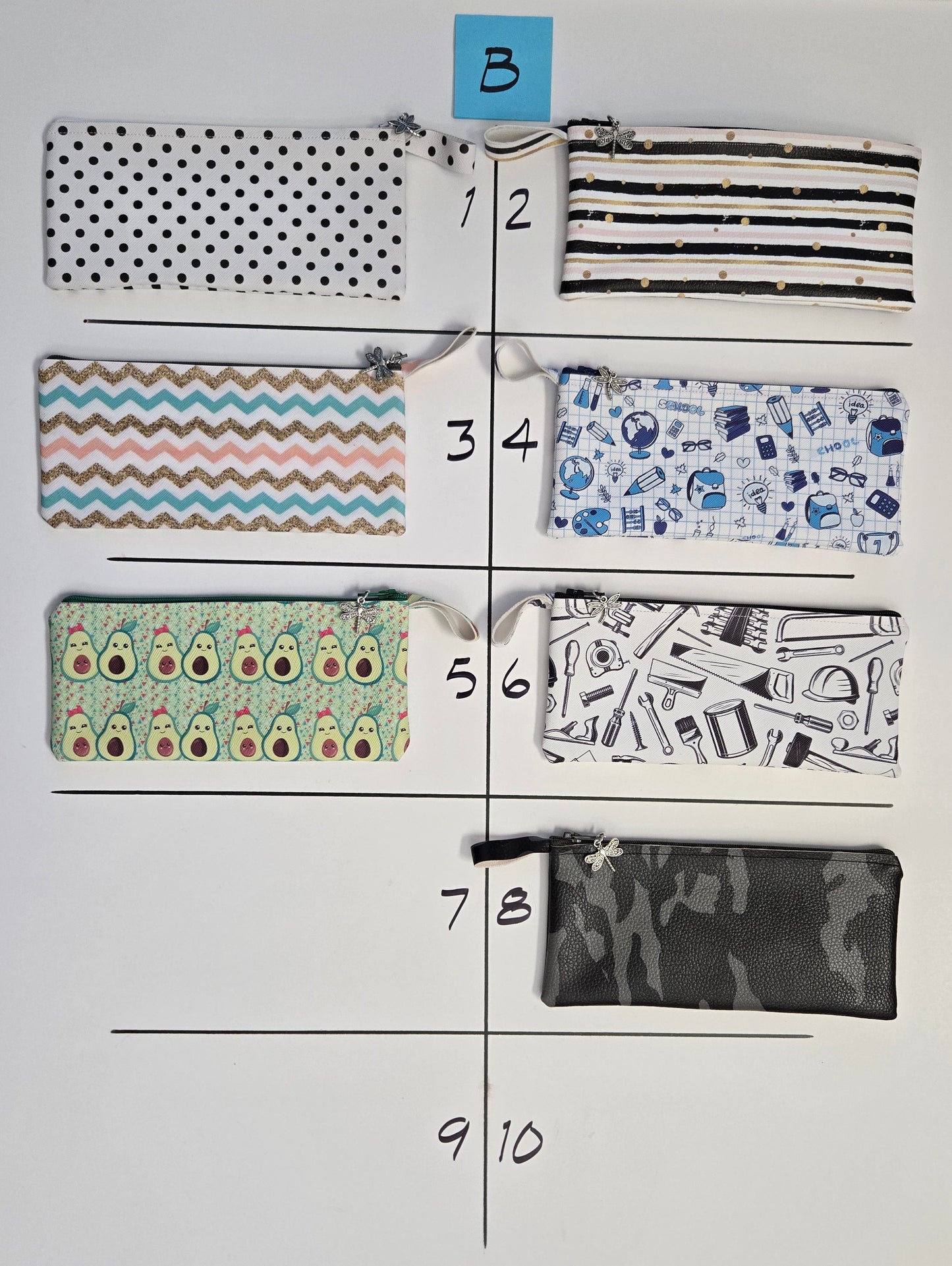 Fabric swatches with various patterns arranged on a white card.
