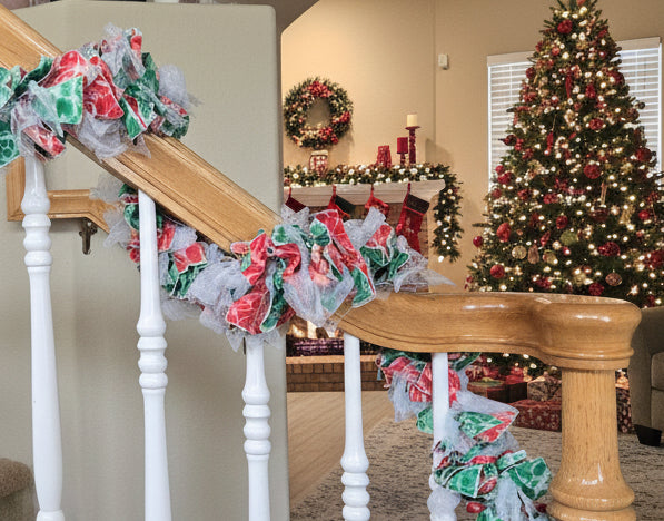 Decorative floral garland on a staircase railing in a home setting.